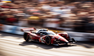 Ambcrypto an image of a racecar speeding down a track with othe c00782b6 25d9 4eba b66c 3265a37f5278 1000x600.png