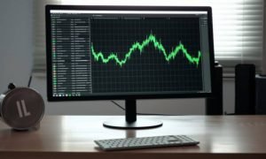 Ambcrypto an image of a litecoin coin in front of a computer. t 32583dee 7699 410d 8ee3 c0977924eccb 1000x600.jpg