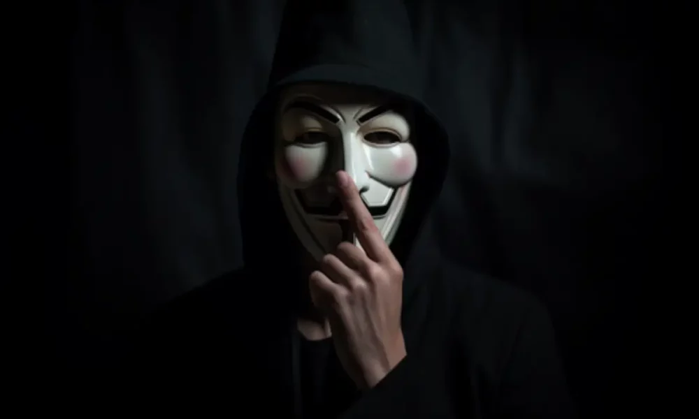 Ambcrypto a person wearing anonymous mask with finger on his li d32605c8 e9a6 42a4 b944 d54496282205 1200x900 1000x600.webp.webp